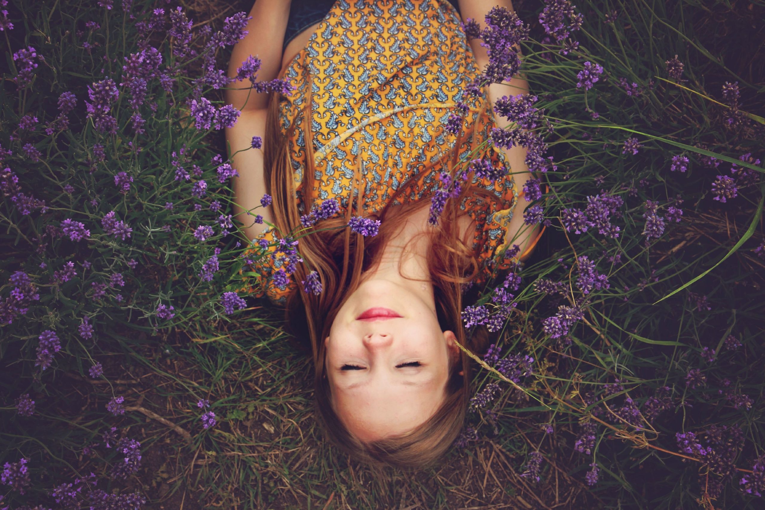 Woman lying in a field of lavendar